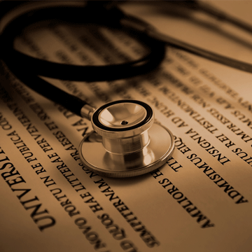 A stethoscope rests on a document